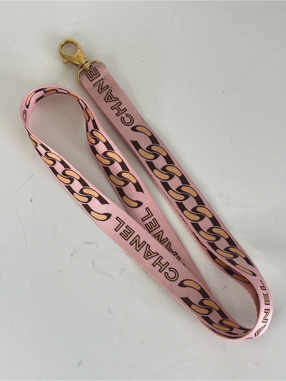CHANEL Pink Chain-Print Lanyard with Gold Hardware